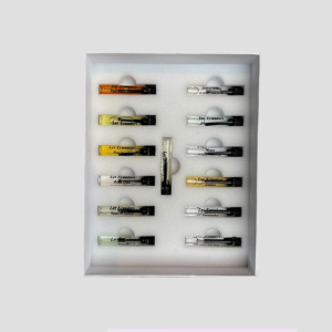 Les-ecuadors-parfums-3 - Les Ecuadors Parfums Tray of small sample vials arranged in a white foam insert inside a shallow box, likely perfume or extract samples.